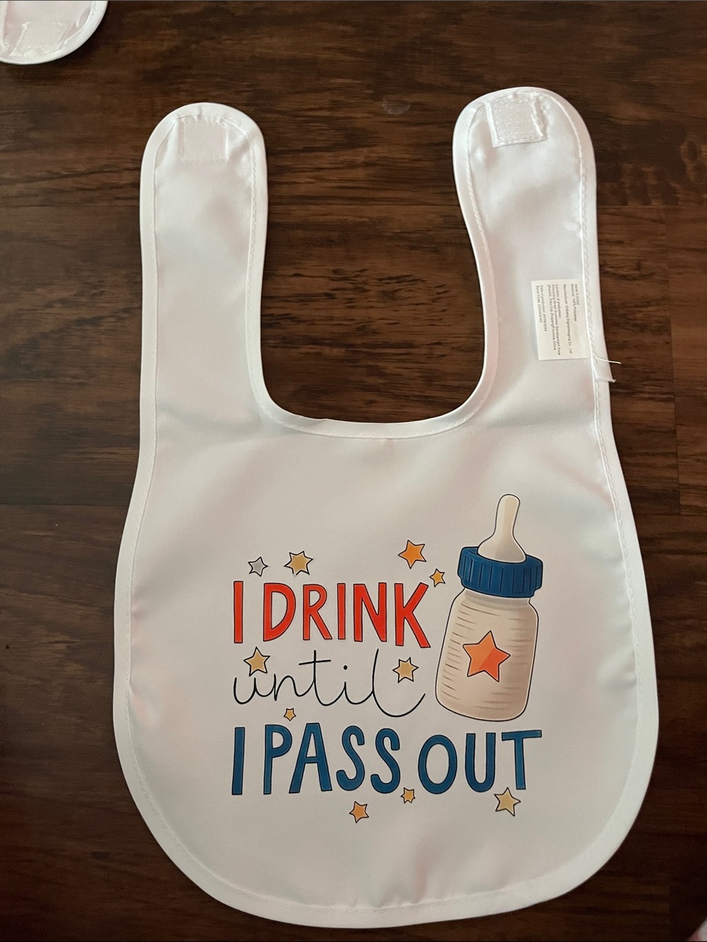 Kids White Bib with Bottle Graphic and 'I Drink Until I Pass Out' Print